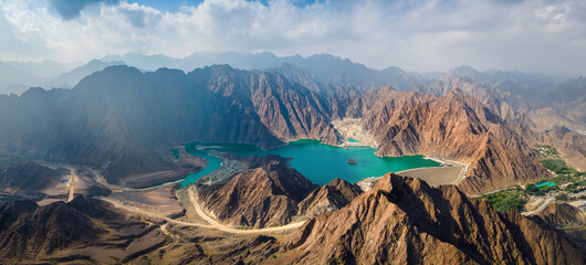 Hatta Dam Lake in eastern region of Dubai, United Arab Emirates aerial panorama - obrazy, fototapety, plakaty