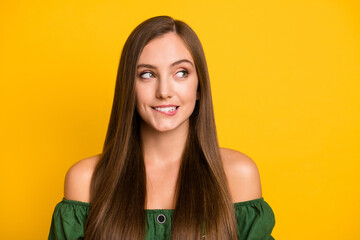 Close-up portrait of pretty curious cheerful brown-haired girl looking aside biting lip isolated...