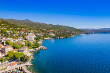 Croatia, beautiful town of Lovran, sea walkway, aerial panoramic view in Kvarner bay coastline, popular tourist destination