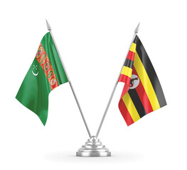 Uganda and Turkmenistan table flags isolated on white 3D rendering