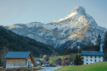 Fototapeta na wymiar Winter landscape with beautiful high mountains in Johnsbach village in The Gesause National Park, in Styria region, Austria