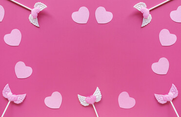 Valentine's day banner. Pink valentine hearts, toppers on pink background. Romantic concept. Flat lay, top view, copy space.