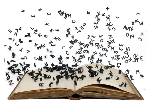 Letters of the alphabet in levitation in the air over the open book