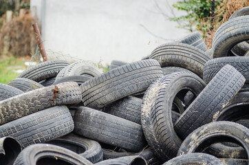 Novi Sad, Serbia - December 21. 2020: A pile of damaged, old, discarded, car tires for recycling