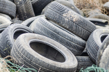 Novi Sad, Serbia - December 21. 2020: A pile of damaged, old, discarded, car tires for recycling