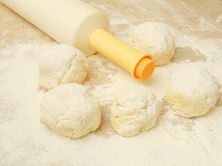 Dough and rolling pin. DIY. Making baked goods at home.