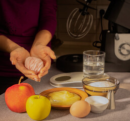 marshmallow lying in the hands of a pastry chef and products for its manufacture