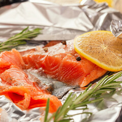Salted red fish in sliced, the cooking process in foil. natural product, dietary food. Healthy food.