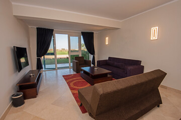 Interior design of luxury apartment living room with patio door