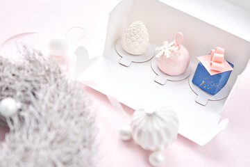 Merry Christmas card. Variety of sweet delicious cakes. Fir branches on a gray background. Merry Christmas card. New year mood