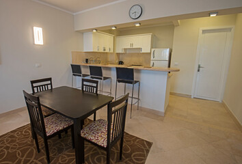 Interior design of luxury apartment dining room and kitchen