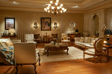 Showroom exhibited modern production furniture in classical period style arranged in a lavishly decorated interiors.