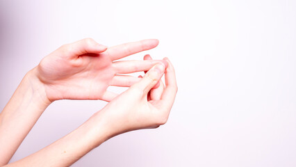 Parkinson's disease symptoms. Close up of tremor (shaking) hands of Middle-aged women patient with...