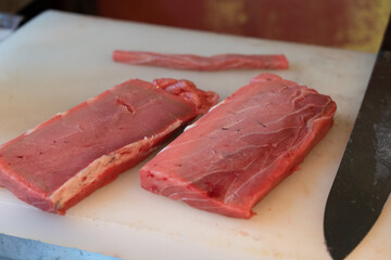 Tuna chunks on a cutting board