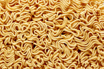 dry raw instant noodles, texture background top view