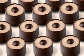 chocolate candies with coffee milk filling, textured background of sweets