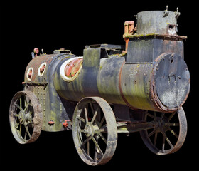 An ancient steam locomotive used in agriculture a hundred years ago isolated
