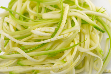 Close-up on a handful of zucchini spaghetti