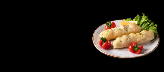 Halibut fillet in layered dough with cheese on a plate	