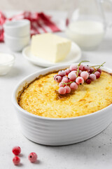 Berry breakfast casserole in a baking dish. Space for text.