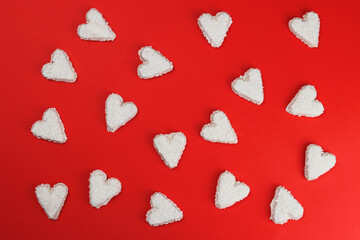 Cookie hearts on red background, background, texture