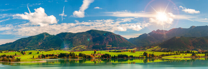 Fototapeta na wymiar panoramic landscape in Bavaria with mountains and meadow at springtime