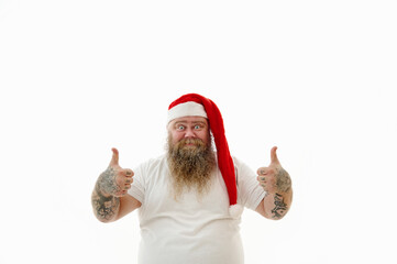 Isolated portrait on a white background of an overweigh man in Santa Claus hat signaling ok ,doing...