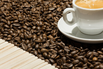 Espresso cup with coffee beans. Coffee background. Text space.
