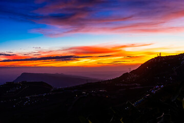 Fototapeta premium Twilight sky of mountain Phu Tub Berk, famous travel location beautiful sea fog at Thailand.