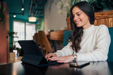 Doing networking, using digital tablet.