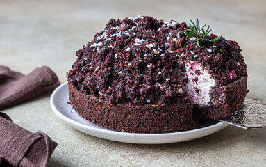 Homemade chocolate cake with cherry and whipped cream. Cake Mink mole or Mole hole cake.