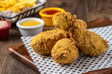 Panko covered fried chicken drumsticks with sauce