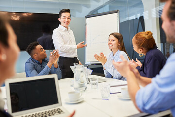 Business people in the start-up team clap