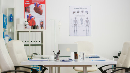 Empty hospital doctor meeting conference room, modern professional office board. Clinic interior with nobody in it, ready for medical conference with profesional doctors.