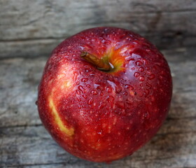 red apple on wooden background