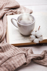 Obraz na płótnie Canvas cup of hot tea and open book