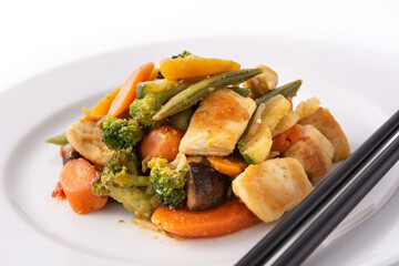 Stir fry chicken with vegetables on plate isolated on white background