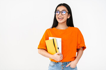 Asian happy student girl smiling while posing with exercise books