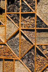 Insect Hotel With Compartments As Shelter For Animals To Improve Biodiversity