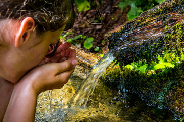 Washing Hands And Drink From A Spring With Clear And Cold Mountain Water