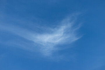 Natural art created by clouds like cotton wool against a blue sky.