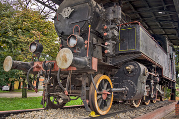 Old steam locomotive on a pedestal