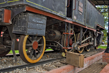 Fototapeta na wymiar Old steam locomotive on a pedestal