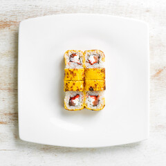 Traditional sushi rolls with cheese. Japanese food. Top view. On a white background.