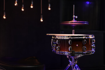 Fototapeta na wymiar Snare drum on dark blurred background close up.