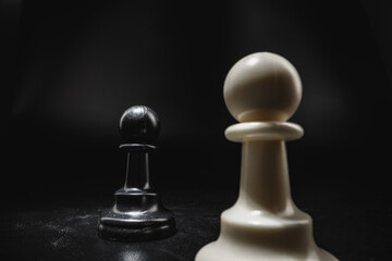 Chess game with chess pieces against black background