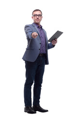 Smiling businessman holding clipboard and pointing at camera isolated on a white background