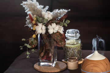 Composition with aroma lamp and decor details.