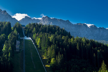 Spectacular Ski Flying and Ski Jumping Facility In Front Of Mountain Grimming In The Alps Of Styria...