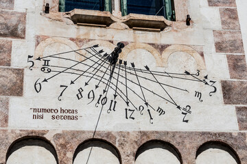 Time On An Old Sundial With Latin Proverb On Building Wall